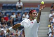 Aug 30, 2018; New York, NY, USA; Roger Federer of Switzerland serves against Benoit Paire of France in a second round match on day four of the 2018 U.S. Open tennis tournament at USTA Billie Jean King National Tennis Center. Mandatory Credit: Jerry Lai-USA TODAY Sports