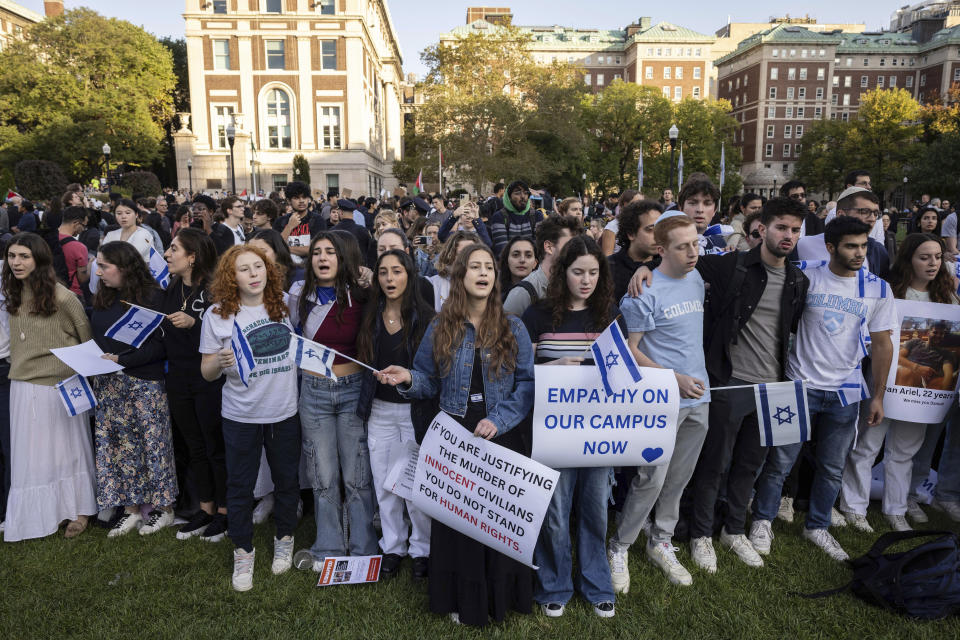 FILE - Pro-Israel demonstrators sing a song during a protest at Columbia University, Thursday, Oct. 12, 2023, in New York. As the death toll rises in the Israel-Hamas war, American colleges have become seats of anguish with many Jewish students calling for strong condemnation after civilian attacks by Hamas while some Muslim students are pressing for recognition of decades of suffering by Palestinians in Gaza. (AP Photo/Yuki Iwamura, File)