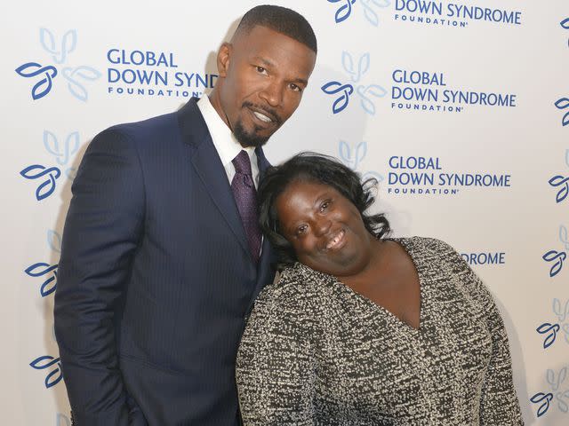 <p>Thomas Cooper/Getty</p> Jamie Foxx with his sister DeOndra Dixon on the red carpet at the Global Down Syndrome Foundation's 2016 "Be Beautiful Be Yourself" on November 12, 2016 in Denver, Colorado