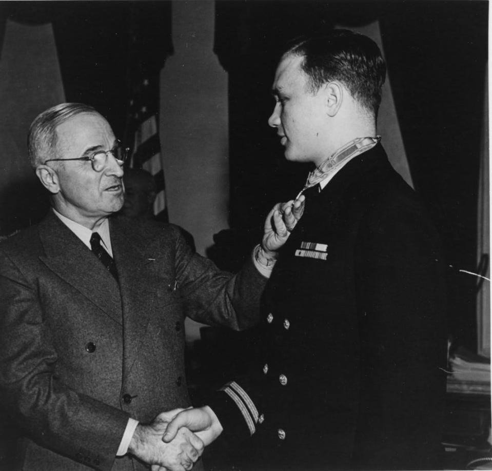 Capt. Richard McCool Jr. is presented with the Medal of Honor by President Harry S. Truman at the White House, Washington, D.C. on Dec. 18, 1945. The medal was awarded for conspicuous gallantry and intrepidity while he was commanding officer of USS LCS 122 off Okinawa, Japan in June 1945.