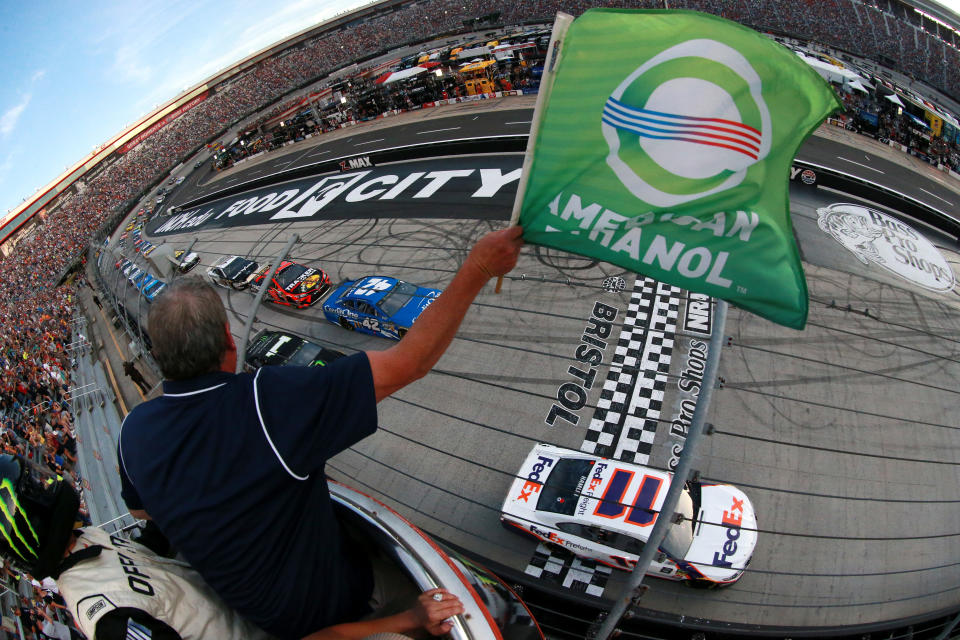 BRISTOL, TENNESSEE - AUGUST 17: Denny Hamlin, driver of the #11 FedEx Freight Toyota, leads the field to the green flag to start the Monster Energy NASCAR Cup Series Bass Pro Shops NRA Night Race at Bristol Motor Speedway on August 17, 2019 in Bristol, Tennessee. (Photo by Sean Gardner/Getty Images)