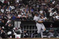 New York Yankees' Giancarlo Stanton, right, hits a one-run single during the eighth inning of a baseball game against the Chicago White Sox in Chicago, Saturday, May 14, 2022. (AP Photo/Nam Y. Huh)