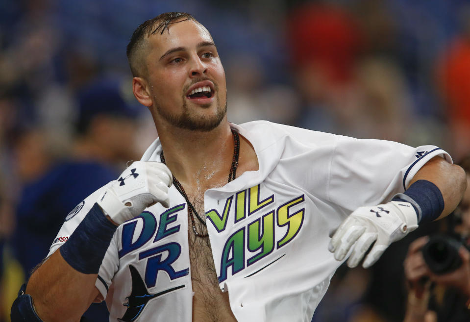 Sep 21, 2019; St. Petersburg, FL, USA;  Tampa Bay Rays first baseman Nate Lowe puts his shirt back on after it was torn off as he celebrated his game winning two run home run during the 11th inning against the Boston Red Sox at Tropicana Field. Mandatory Credit: Reinhold Matay-USA TODAY Sports