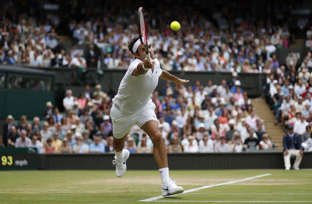 Switzerland's Roger Federer in action against USA's Steve Johnson. REUTERS/Andrew Couldridge