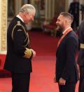 <p>The actor, who declined to talk to the waiting press, was presented with his CBE insignia by the Prince of Wales.</p>