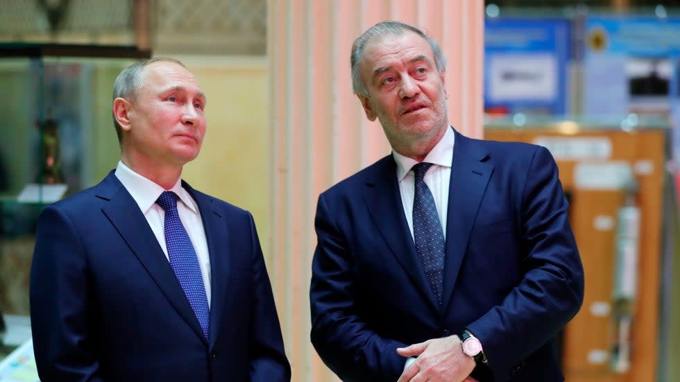 Russian President Vladimir Putin, left, and Mariinsky Theatre's Artistic Director Valery Gergiev