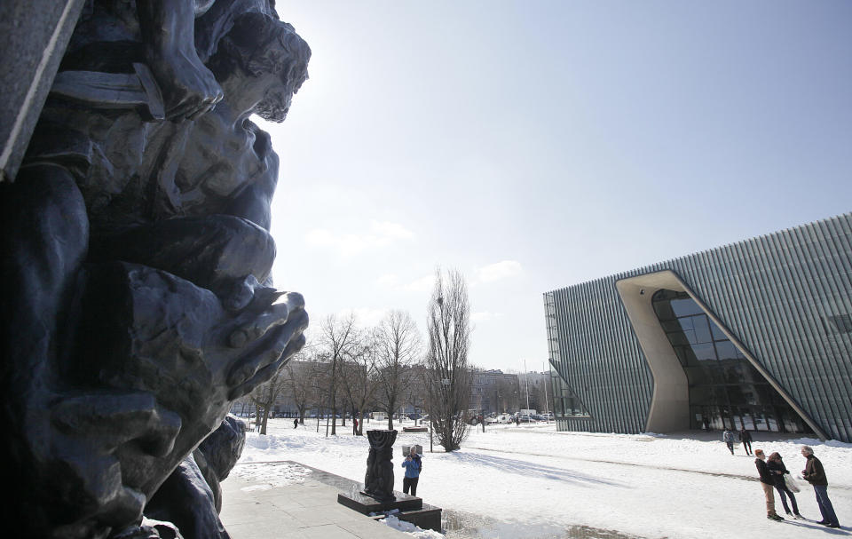 This Monday, April 8, 2013 photo shows the Museum of the History of Polish Jews. At left is a monument honoring the fighters of the uprising. The revolt gave the world an enduring symbol of defiance against impossible odds, but in a Poland still adjusting to its post-Cold War freedoms, the memory of the Holocaust still engenders controversy in some quarters. The ambitious new museum that is opening in the ruins of the Jews’ prison of misery and death does not shy away from Poland's own history of anti-Semitism a sign, many say, that the country is maturing and riding a wave of confidence-building economic growth. (AP Photo/Czarek Sokolowski)