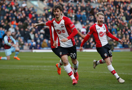 Soccer Football - Premier League - Burnley vs Southampton - Turf Moor, Burnley, Britain - February 24, 2018 Southampton's Manolo Gabbiadini celebrates scoring their first goal with Josh Sims REUTERS/Andrew Yates