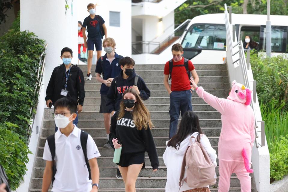 Students at the Hong Kong International School in Tai Tam are greeted by a mascot. Photo: Dickson Lee