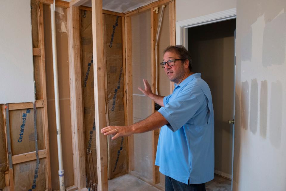 Escambia County resident David Bryan describes the lack of work completed by Banks Construction on his home's bathroom on Monday, Aug. 8, 2022. Banks Construction began the remodel late last year and has not finished the job after taking thousands of dollars in payment. 