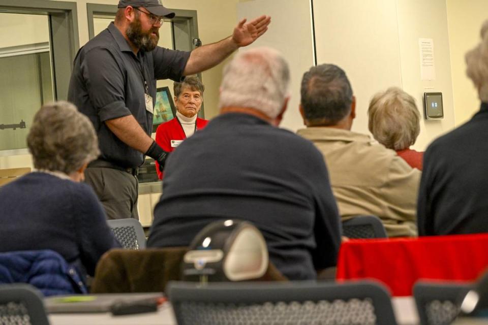 Murriel Oles, 80, watches as her seventh grandchild, Robert Yannacone, helps give technical instruction during a training session for election workers at the Placer County Elections Office in Rocklin on Friday. Oles said she got teary eyed when she thought she thought this might be her last election.