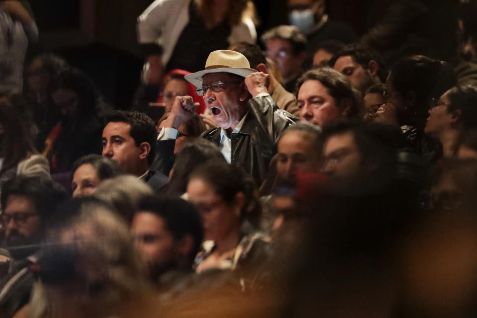 A man screams asking for information about missing people during the ceremony to release a truth commission report on the country's internal conflict, in Bogota, Colombia, Tuesday, June 28, 2022. A product of the 2016 peace deal between the government and the Revolutionary Armed Forces of Colombia, FARC, the commission was tasked to investigate human rights violations committed by all actors between 1958 and 2016. (AP Photo/Ivan Valencia)