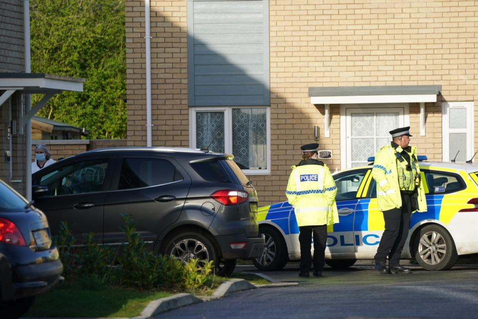 Police at the scene in Meridian Close, Bluntisham, Cambridgeshire, which has been cordoned off (PA)