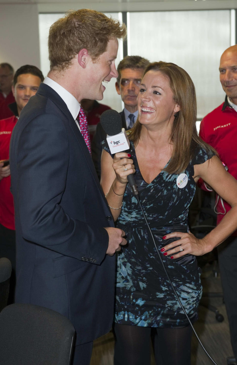 Britain&#39;s Prince Harry talks to British TV and radio presenter Natalie Pinkham on the trading floor as he attends BGC Partners&#39; Charity Day in London, on September 12, 2011. Britain&#39;s Prince Harry, co-founder and Patron of Sentebale, today attended BGC Partners&#x002019; Charity Day, which is held each year to commemorate the company&#x002019;s 658 employees who lost their lives in the 9/11 attacks on the World Trade Center. Prince Harry helped raise money for Sentebale and other charities by supporting BGC Partners in deals on the trading floor. AFP PHOTO / PAUL GROVER / POOL (Photo credit should read PAUL GROVER/AFP via Getty Images)