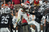 Kansas City Chiefs running back Darrel Williams (31) catches a pass in the end zone for a touchdown over Las Vegas Raiders safety Johnathan Abram (24) during the second half of an NFL football game, Sunday, Nov. 14, 2021, in Las Vegas. (AP Photo/Rick Scuteri)