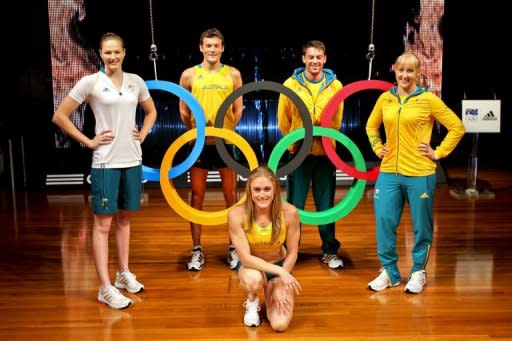 Australian Olympic athletes (from L) Cate Campbell, Craig Mottram, Sally Pearson, Mitchell Watt and Jessica Schipper pose during the unveiling of the Australian Olympic team uniforms at Sydney Olympic Park, in March