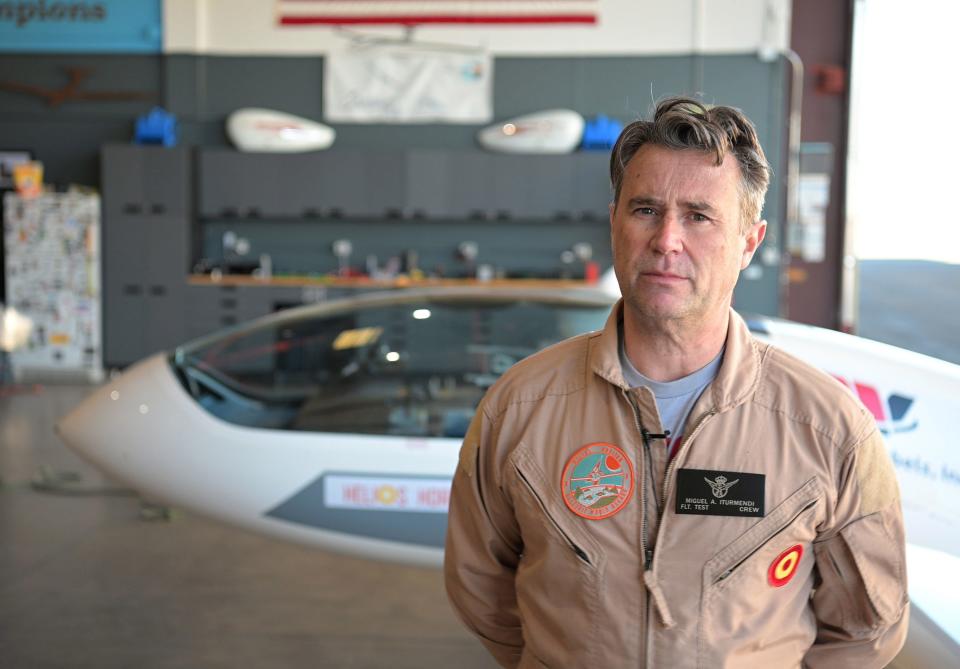 Miguel Iturmendi stands in front of the Helios Horizon in the hangar at Independence, California, which is near the eastern Sierra Nevada mountain range.