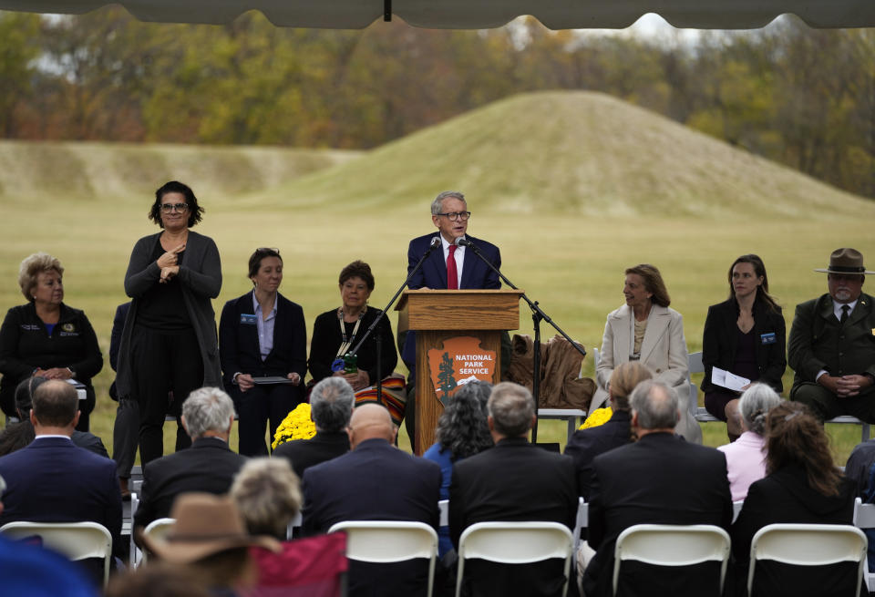 Ohio Gov. Mike DeWine speaks during the Hopewell Ceremonial Earthworks UNESCO World Heritage Inscription Commemoration ceremony, at the Mound City Group at Hopewell Culture National Historical Park in Chillicothe, Ohio, Saturday, Oct. 14, 2023. A network of ancient American Indian ceremonial and burial mounds in Ohio noted for their good condition, distinct style and cultural significance, including Hopewell, was added to the list of UNESCO World Heritage sites. (AP Photo/Carolyn Kaster)