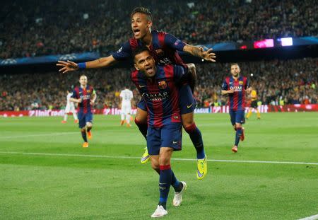 Neymar celebrates with Dani Alves after scoring the second goal for Barcelona. Reuters / Albert Gea