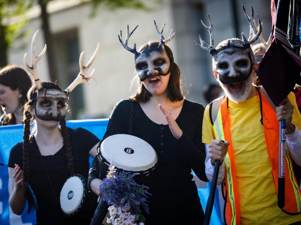 Extinction Rebellion activists march to the Wilson Building, the seat of DC’s local governance, for an Earth Day protest to ‘stop all new fossil fuel infrastructure in the nation’s capital' (Jim Lo Scalzo/EPA)