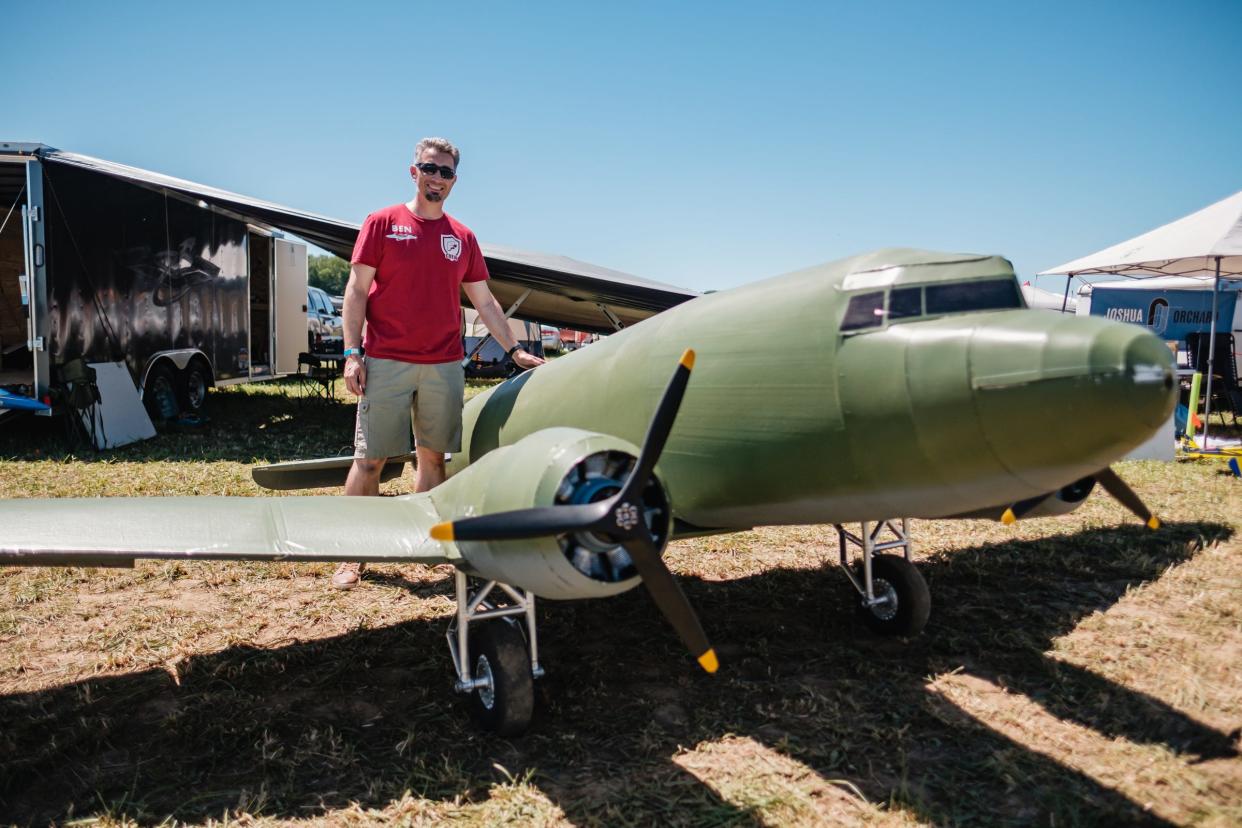 Ben Harber, from Gunnersville, AL, poses with his one-quarter scale WWII era C-47 cargo plane during ‘Flite Fest’ in Malvern, Friday, June 24.