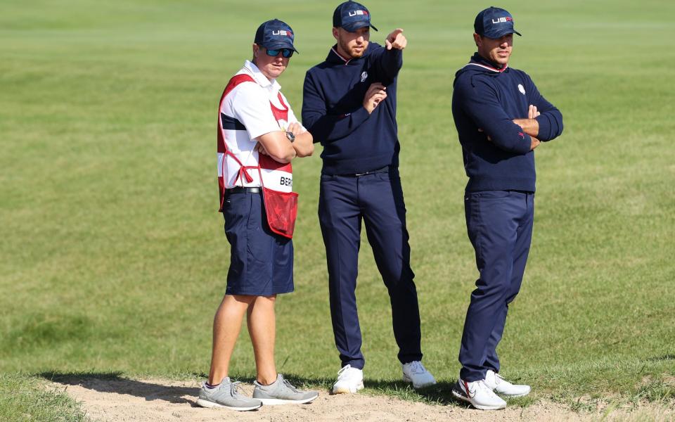 Berger and Koepka line up a shot on the 15th - Getty Images