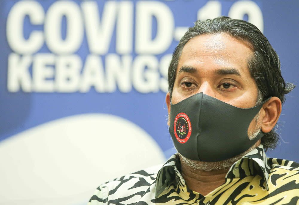 Minister of Science, Technology and Innovation Khairy Jamaluddin speaks to reporters during a visit to the vaccination centre at the Indera Mulia Stadium in Ipoh March 16, 2021. — Picture by Farhan Najib