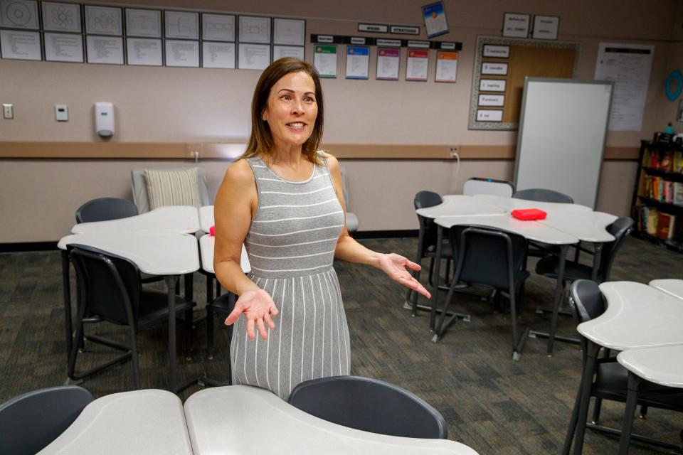 Cindy Bellamy, an English teacher at Palm Springs High School, smiles as she talks about the start of the new school year inside her classroom on Tuesday.