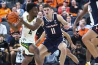 Baylor guard LJ Cryer (4) looks to pass the ball as Virginia guard Isaac McKneely (11) defends during the first half of an NCAA college basketball game Friday, Nov. 18, 2022, in Las Vegas. (AP Photo/Chase Stevens)