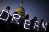 <p>Demonstrators hold illuminated signs during a rally supporting the Deferred Action for Childhood Arrivals program (DACA), or the Dream Act, outside the U.S. Capitol building in Washington, D.C., on Thursday, Jan. 18, 2018. (Photo: Zach Gibson/Bloomberg via Getty Images) </p>