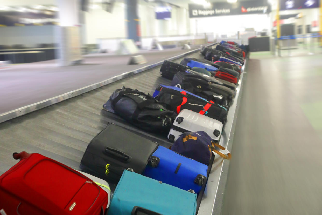 luggage on airport conveyor belt