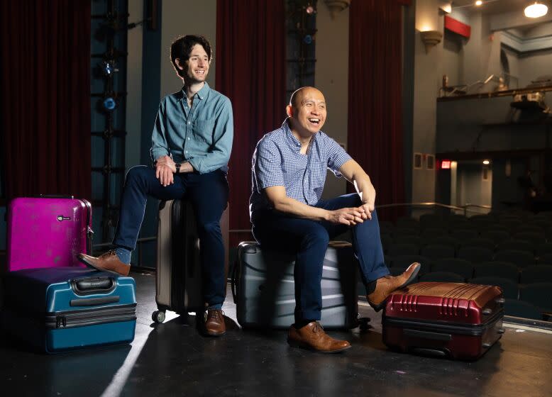 LOS ANGELES-CA-MAY 15, 2023: East West Players' new world-premiere musical "On This Side of the World," co-creators Paulo K Tirol, right, and Noam Shapiro are photographed at the David Henry Hwang Theater in Los Angeles on May 15, 2023. (Christina House / Los Angeles Times)