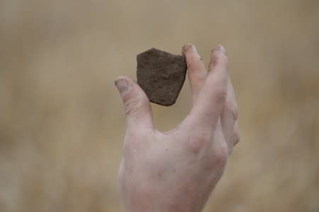 Army veterans and archeologists dig as part of archaeological research campaign called "Waterloo Uncovered" in Waterloo