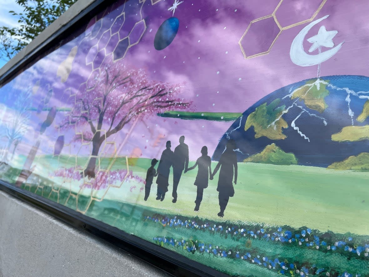 The artwork on the Our London Family Memorial Plaza shows the silhouette of the Afzaal family. Four of the five members of the family were killed in an attack June 6, 2021, while out on a walk in the southwestern Ontario city. (Travis Dolynny/CBC - image credit)