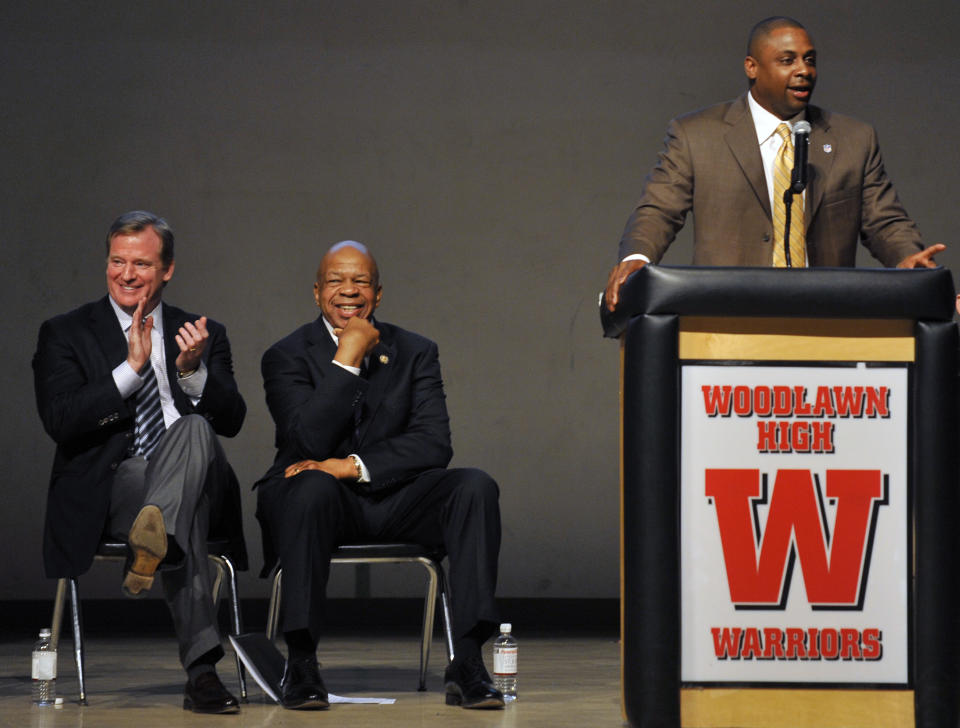 NFL Vice President and former NFL player Troy Vincent speaks while Roger Goodell and Elijah Cummings look on.