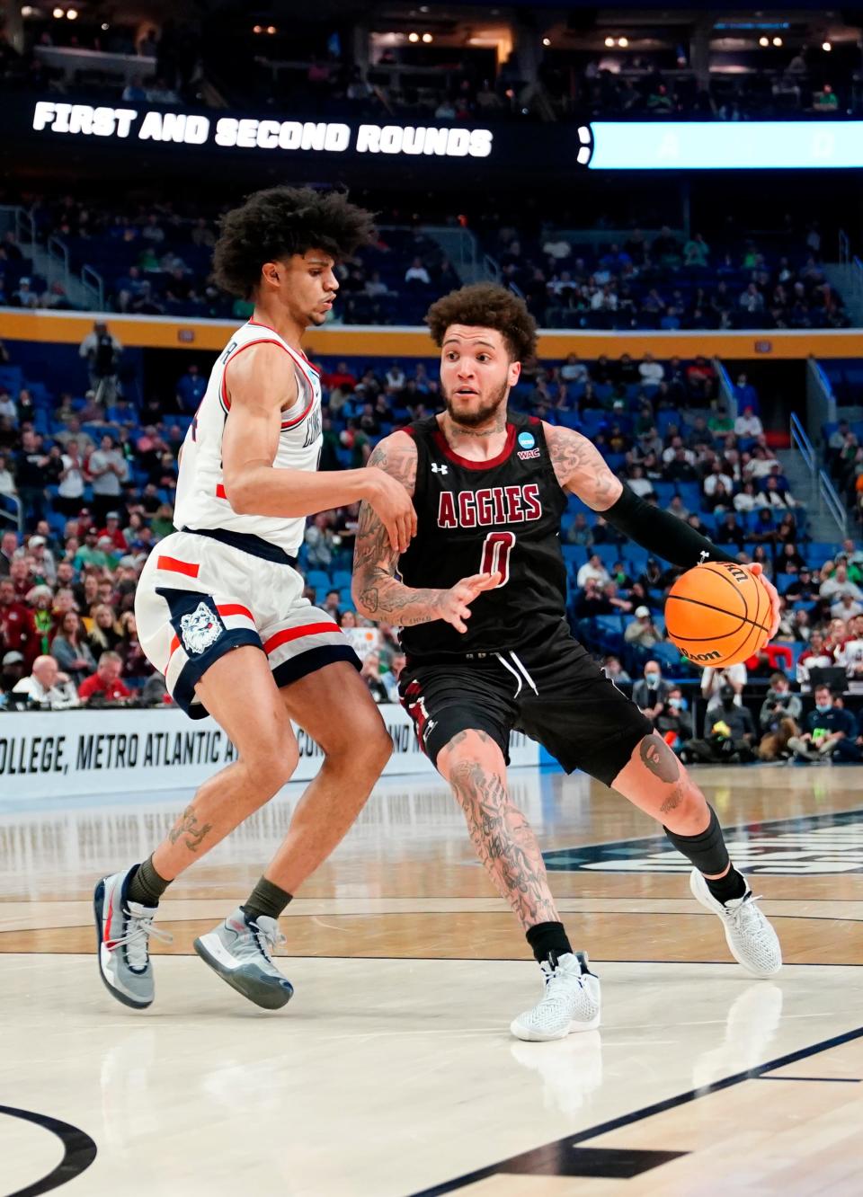 Mar 17, 2022; Buffalo, NY, USA; New Mexico State Aggies guard Teddy Allen drives to the basket in the first half against the Connecticut Huskies during the first round of the 2022 NCAA Tournament at KeyBank Center on Thursday, March 17, 2022, in Buffalo, N.Y.