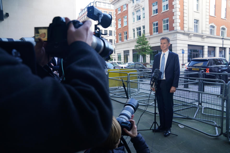 Chancellor Jeremy Hunt speaks to the media on Sunday. (PA)