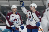 Colorado Avalanche center Tyson Jost (17) is congratulated by teammate Jacob MacDonald (26) after scoring a goal against the San Jose Sharks during the second period of an NHL hockey game in San Jose, Calif., on Wednesday, May 5, 2021. (AP Photo/Tony Avelar)