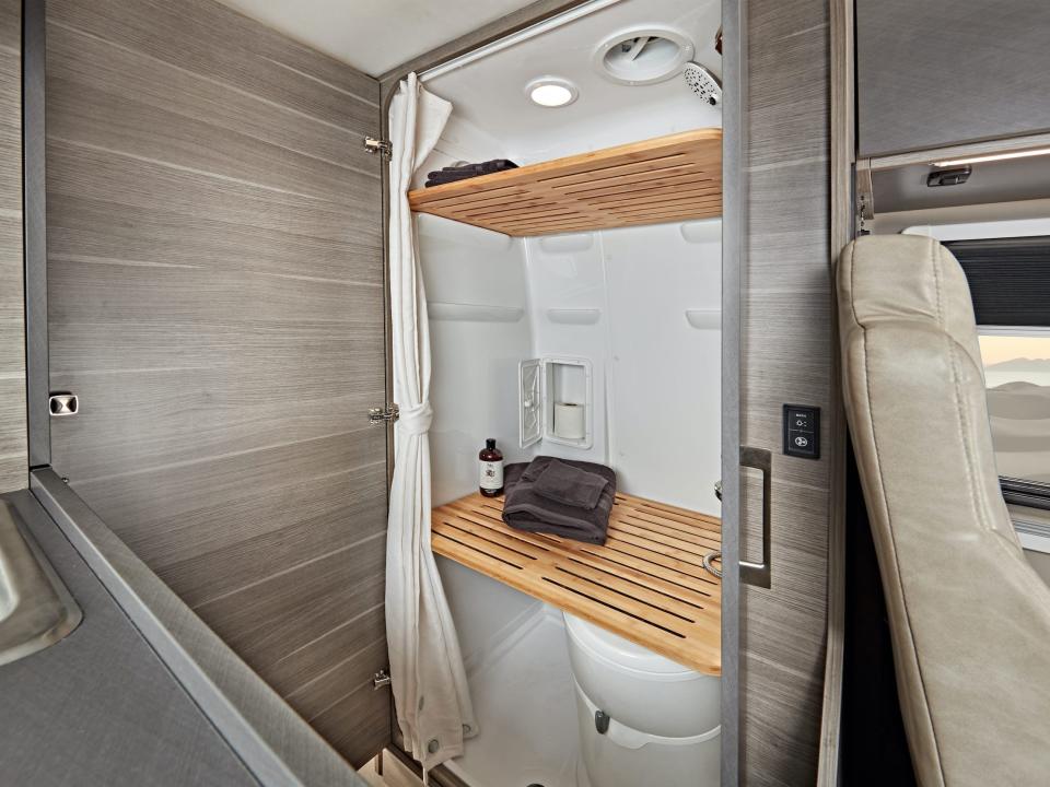 The bathroom inside the 2022 Jayco Terrain besides the kitchen