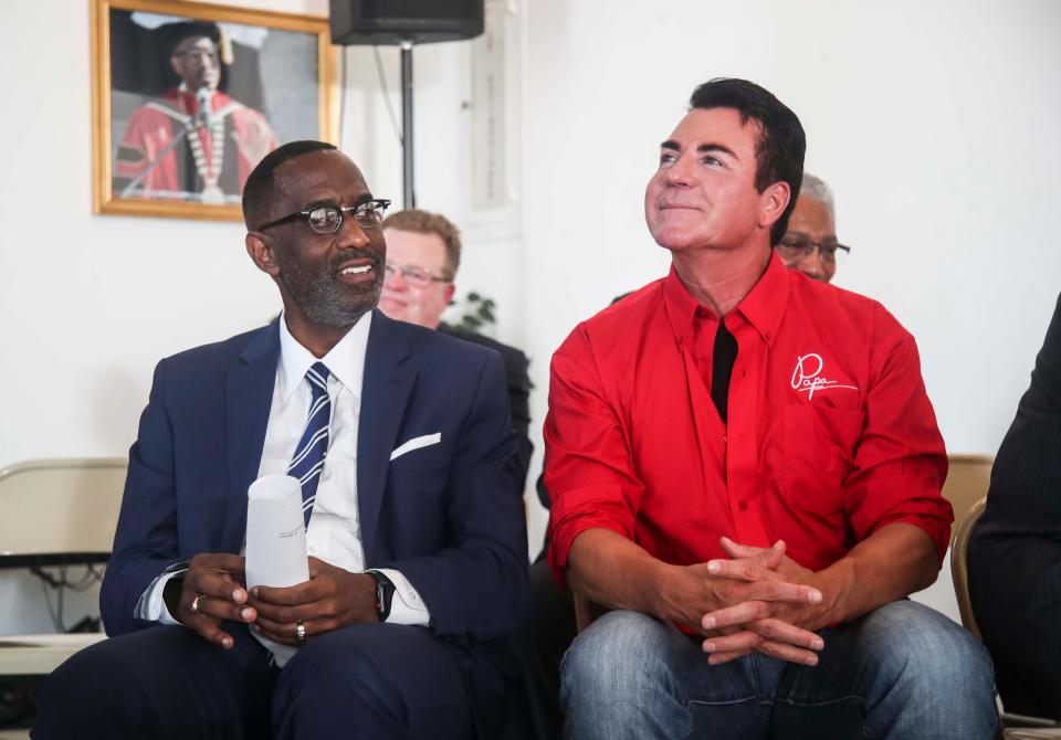 Papa John's founder John Schnatter, right, sits with the Rev. Kevin Cosby at Simmons College on Wednesday afternoon at the private black college in Kentucky. Schnatter has donated $1 million to the school.