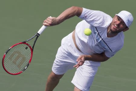 Mardy Fish of the U.S. serves to Feliciano Lopez of Spain during their second round match at the U.S. Open Championships tennis tournament in New York, September 2, 2015. REUTERS/Adrees Latif Picture Supplied by Action Images