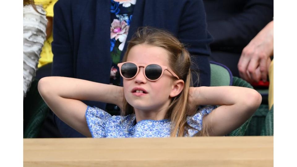 Princess Charlotte relaxing with her arms behind her