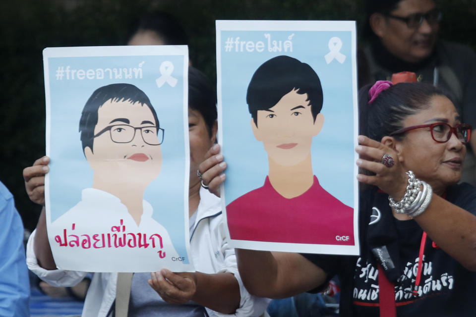 Pro-democracy activists display images of protest leaders that are kept in detention during a protest outside remand prison, in which some of the activists are kept, in Bangkok, Thailand, Friday, Oct. 23, 2020. Thailand's government on Thursday canceled a state of emergency it had declared last week for Bangkok in a gesture offered by the embattled prime minister to cool student-led protests seeking democracy reforms. (AP Photo/Sakchai Lalit)