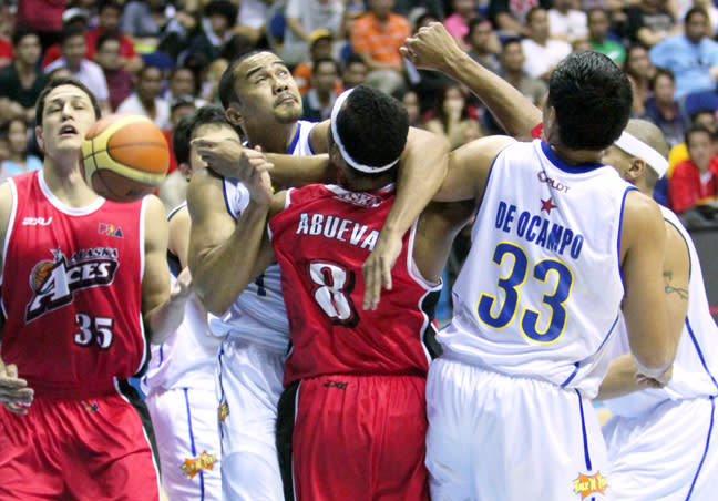 Calvin Abueva is sandwiched by Aaron Aban and Ranidel De Ocampo. (PBA Images)