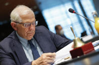 European Union foreign policy chief Josep Borrell looks at his papers during a European Foreign Affairs Ministers meeting at the European Council building in Luxembourg, Monday, June 21, 2021. EU foreign ministers were set to approve Monday a new set of sanctions against scores of officials in Belarus and prepare a series of measures aimed at the country's economy. (Johanna Geron/Pool Photo via AP)