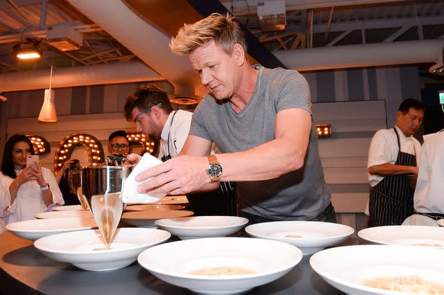 <p>GP Images/WireImage</p> Gordon Ramsay plating a dish.