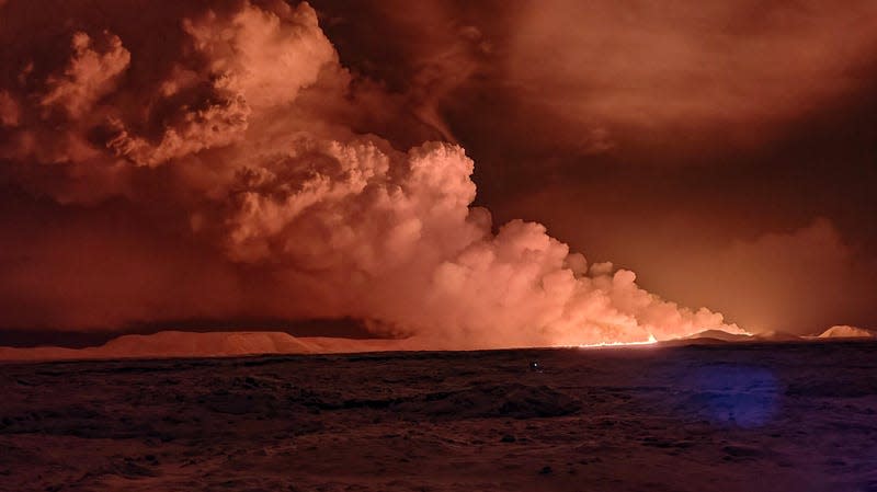 Smoke billows from a crevasse near Grindavík, Iceland.