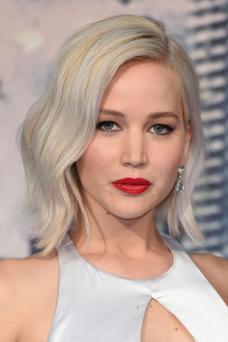 <p>Lawrence gave her white blonde hair a Nordic silver twist.</p>