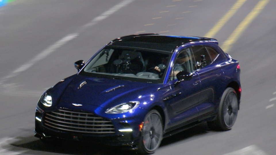 a blue car on a road