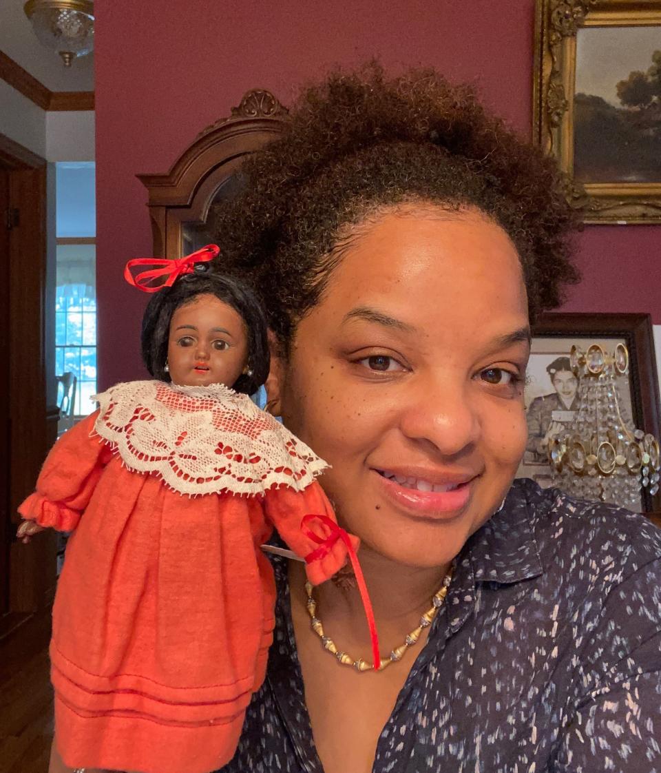 Shawn R. Jones with one of her antique Black dolls.